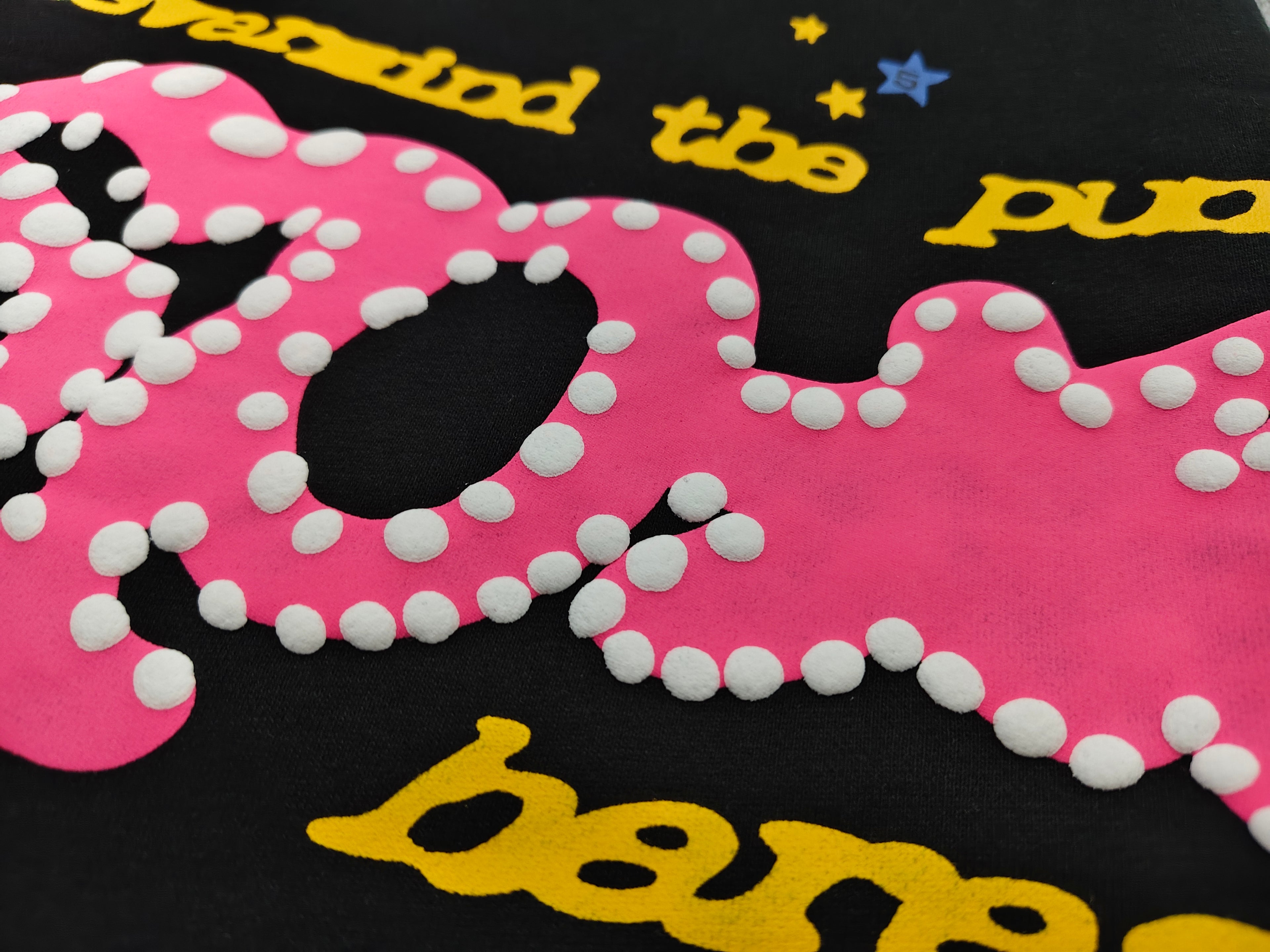 Sp5der Punk V2 shorts in black, featuring a vibrant pink logo and scattered colorful stars