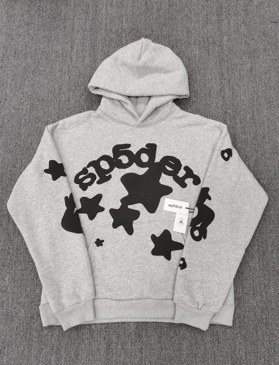 Sp5der Worldwide Beluga hoodie features a distinctive black star graphic across the chest on a light grey heather fabric