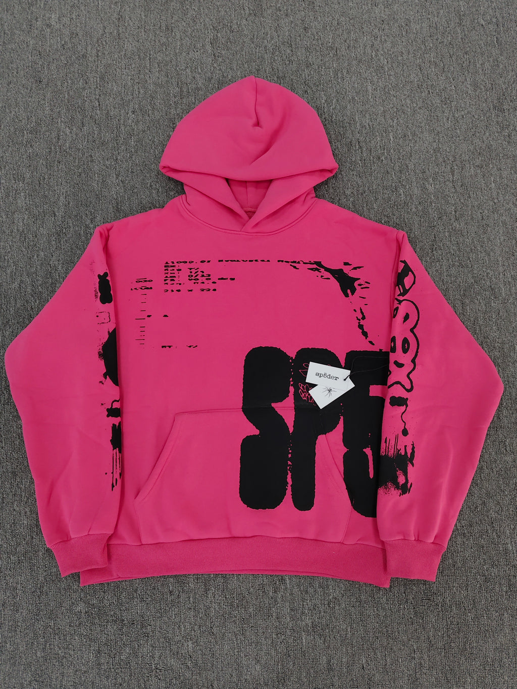 hot pink Sp5der hoodie featuring large, bold black screen-printed graphics on the front and arms.