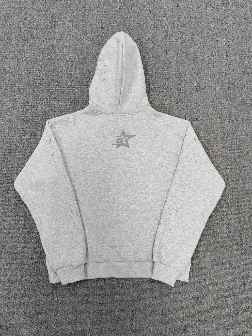 a Sp5der Tonal Punk V2 Hoodie in Sport Grey, featuring a rhinestone-embellished logo and scattered star graphics