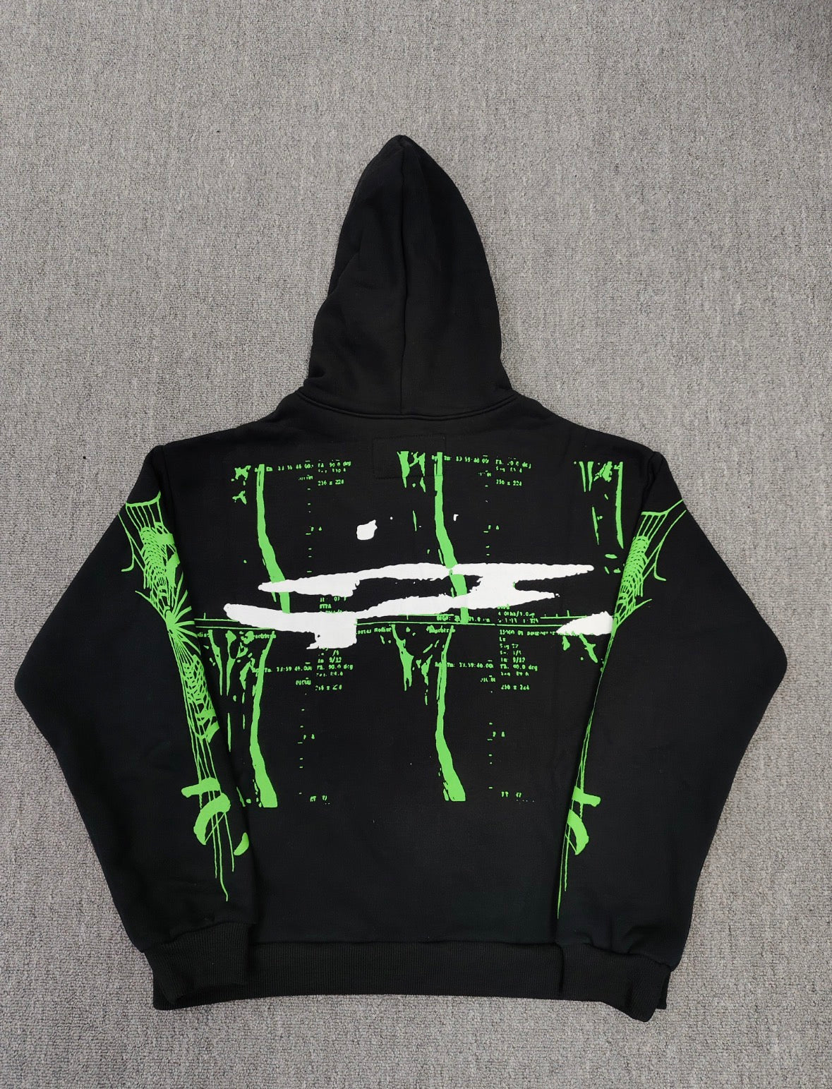 black Sp5der X-Ray Hoodie featuring prominent neon green slime-style graphics