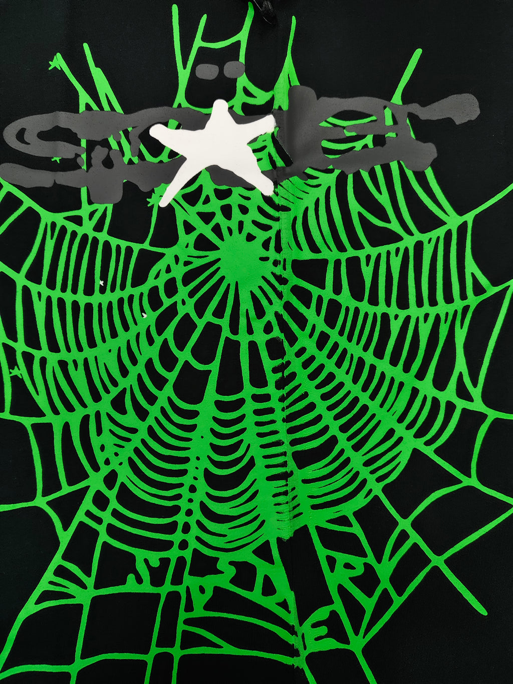 a Sp5der Heavy Web T-shirt in black featuring a prominent neon green web graphic and scattered star print