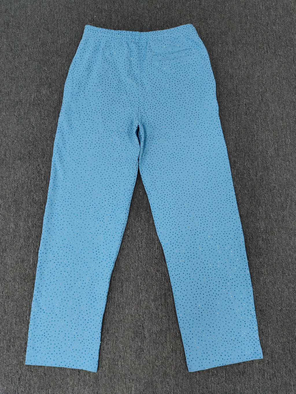 sky blue Sp5der Classic Sweatpants feature an all-over rhinestone design and the brand's logo in a sparkling applique
