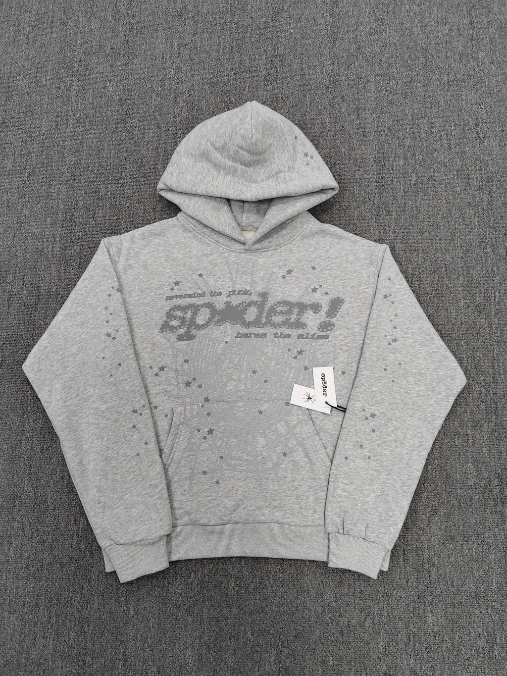 a Sp5der Tonal Punk V2 Hoodie in Sport Grey, featuring a rhinestone-embellished logo and scattered star graphics