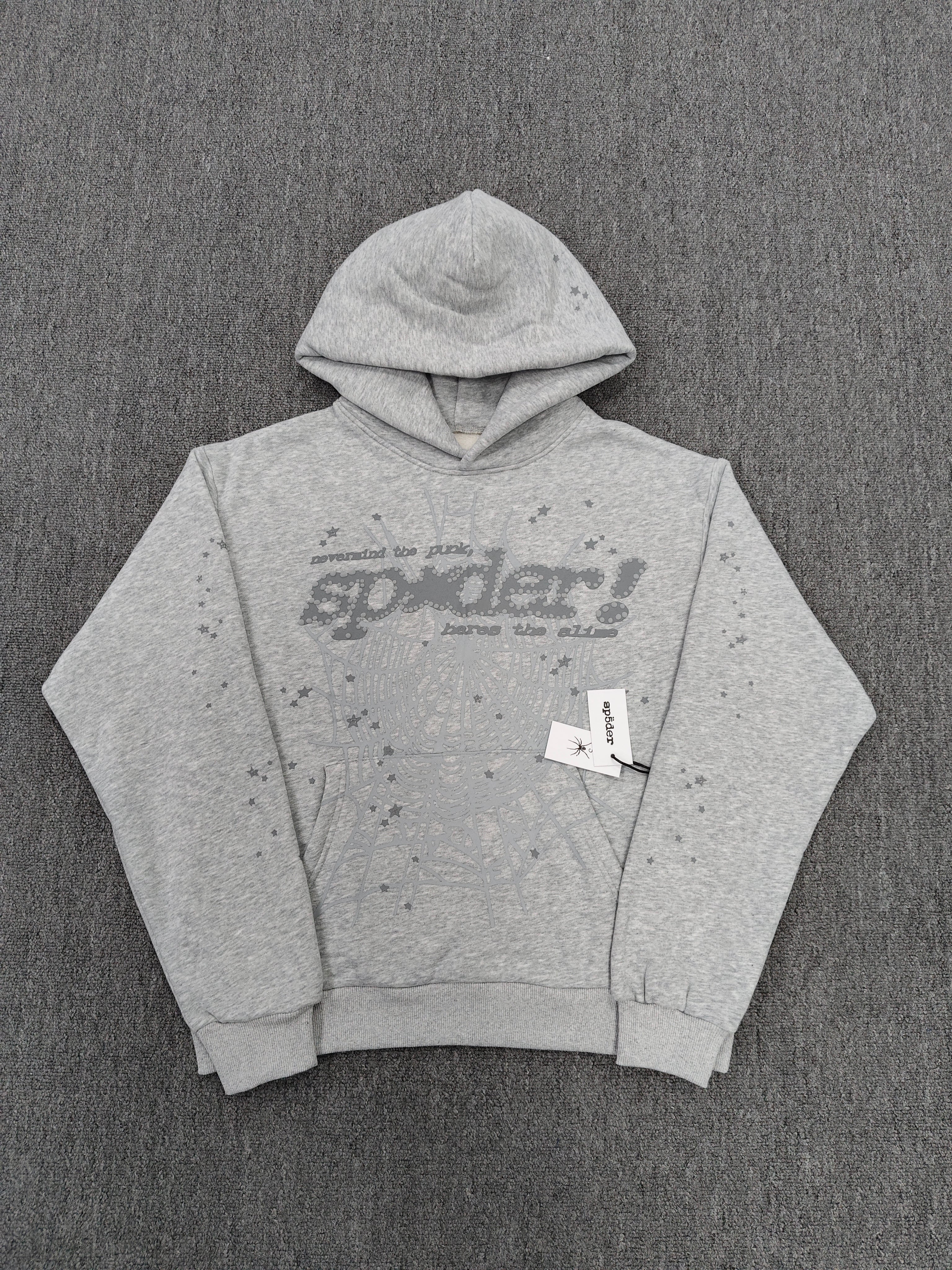 a Sp5der Tonal Punk V2 Hoodie in Sport Grey, featuring a rhinestone-embellished logo and scattered star graphics