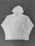 a Sp5der VVS Hoodie in Heather Grey, recognized by its all-over tonal rhinestones and arch logo