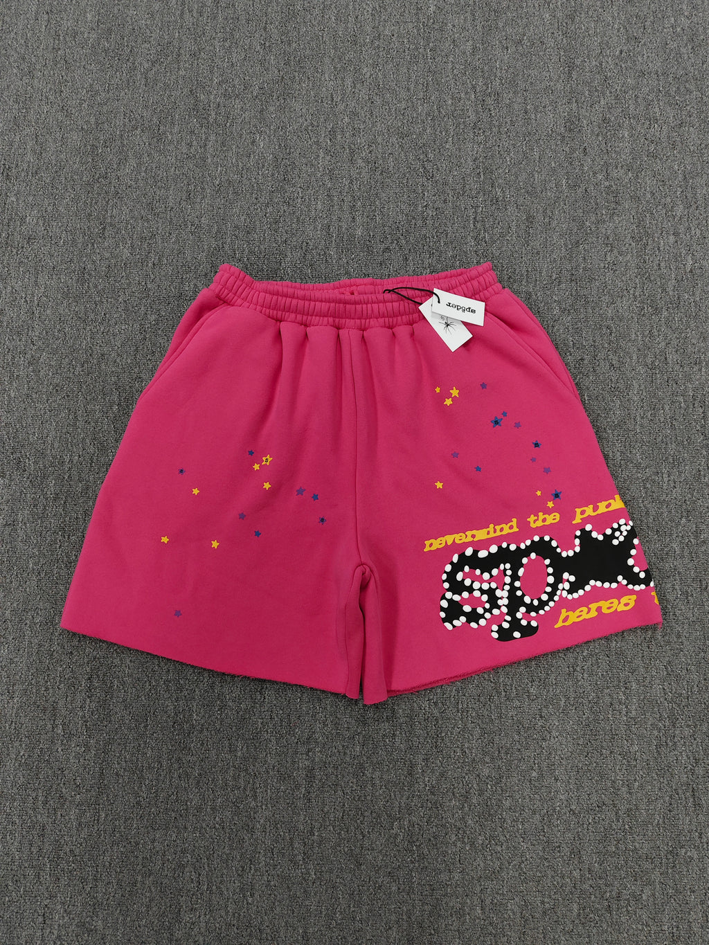 pink shorts Sp5der "Punk V2" collection, featuring rhinestone branding and scattered star graphics