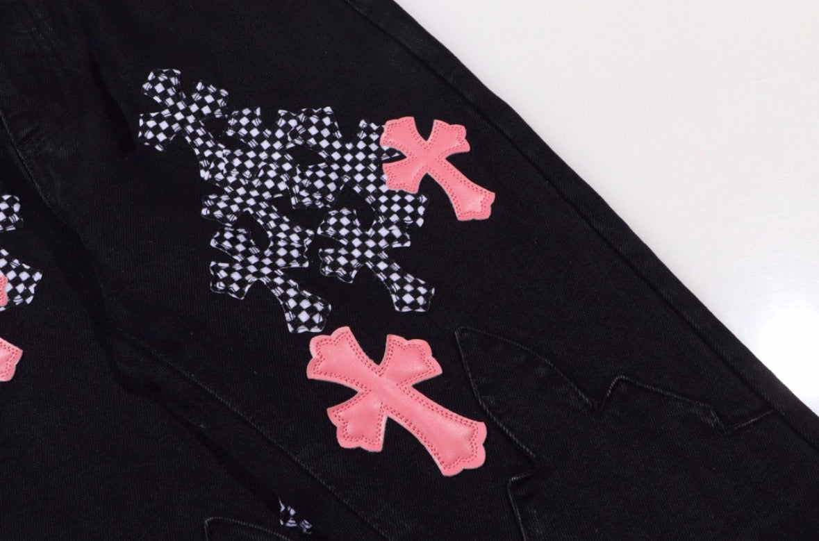 Chrome Hearts jeans featuring pink leather and checkered pony hair cross patches