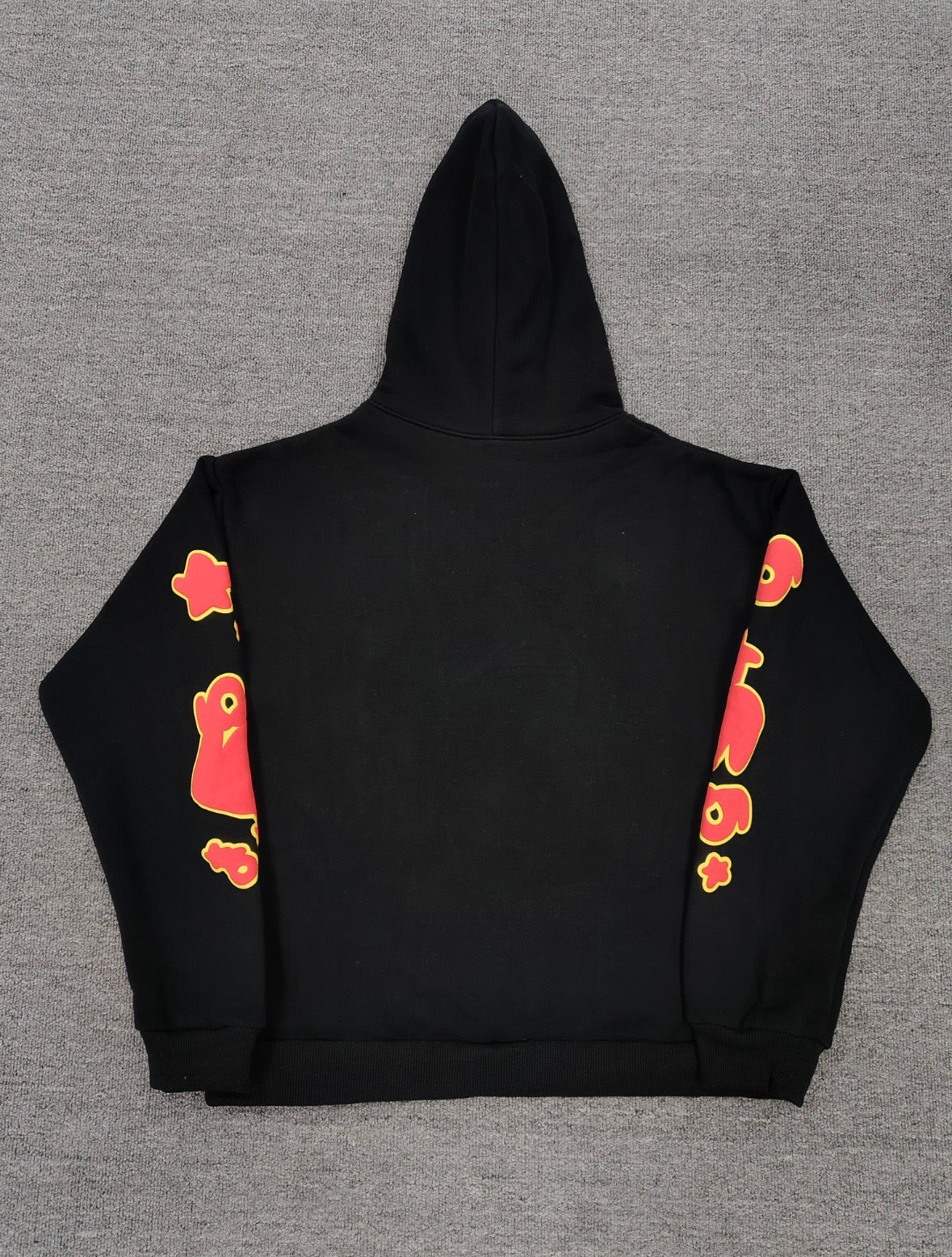 Sp5der x UY SCUTI Hoodie in black features prominent red star graphics
