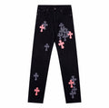 Chrome Hearts jeans featuring pink leather and checkered pony hair cross patches