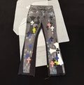 Chrome Hearts distressed jeans featuring a multicolor patchwork application of their iconic cross motif.