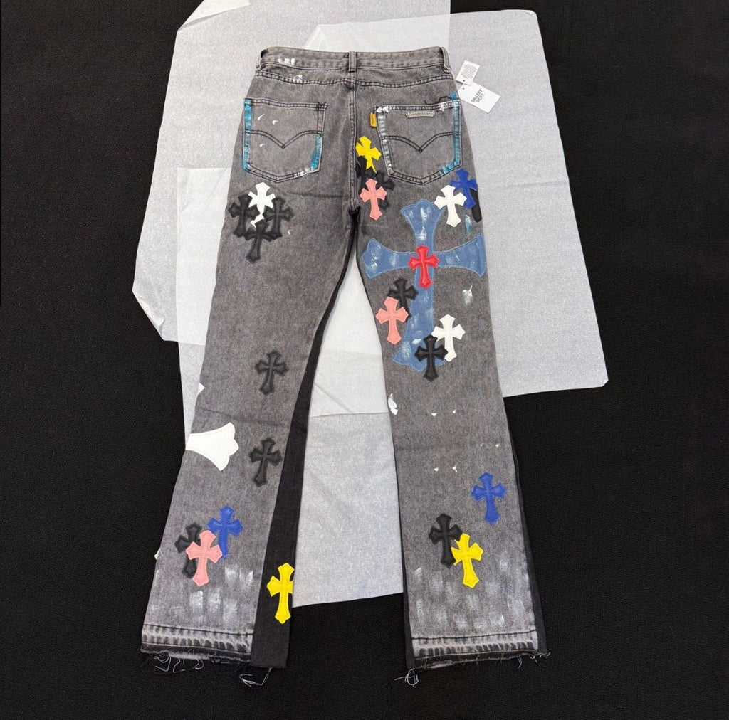 Chrome Hearts distressed jeans featuring a multicolor patchwork application of their iconic cross motif.
