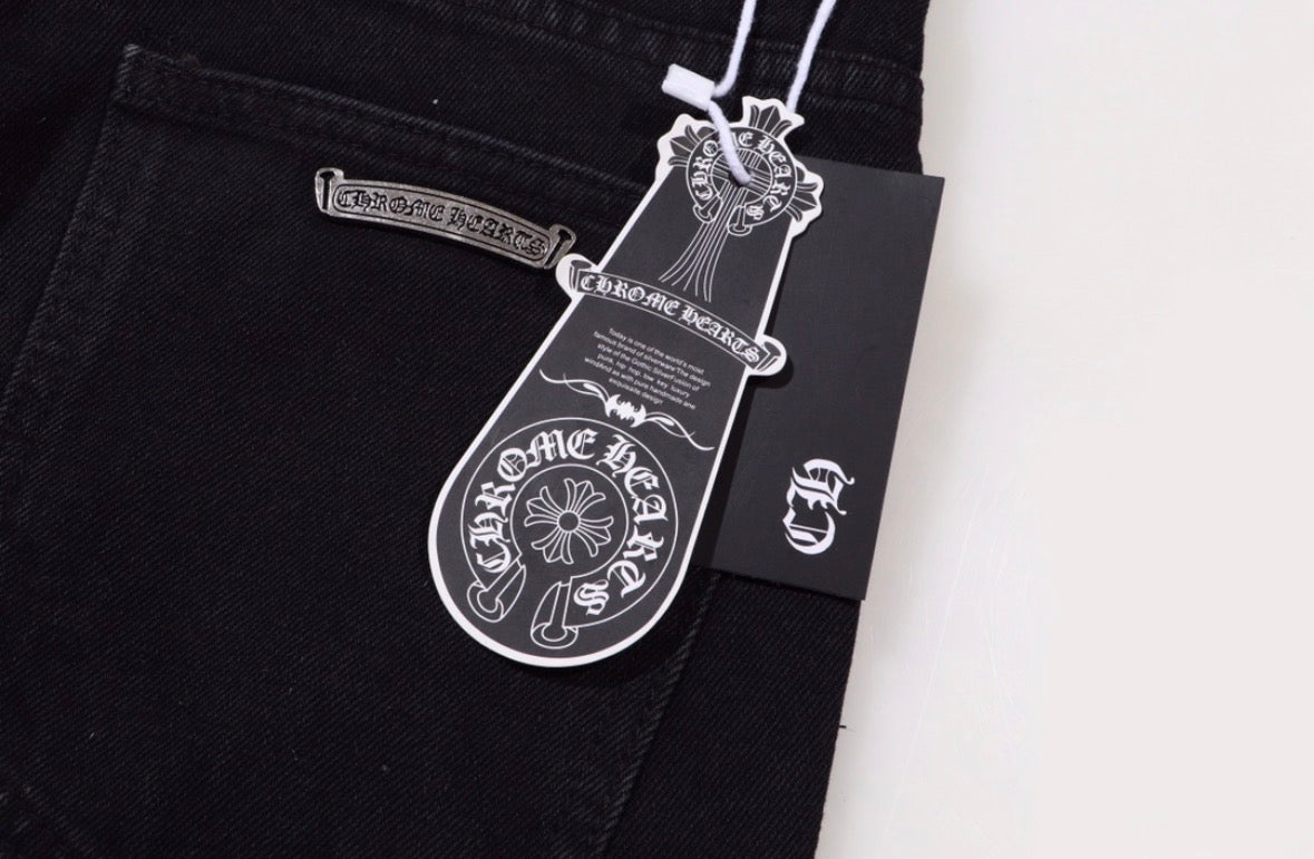 Chrome Hearts jeans featuring pink leather and checkered pony hair cross patches