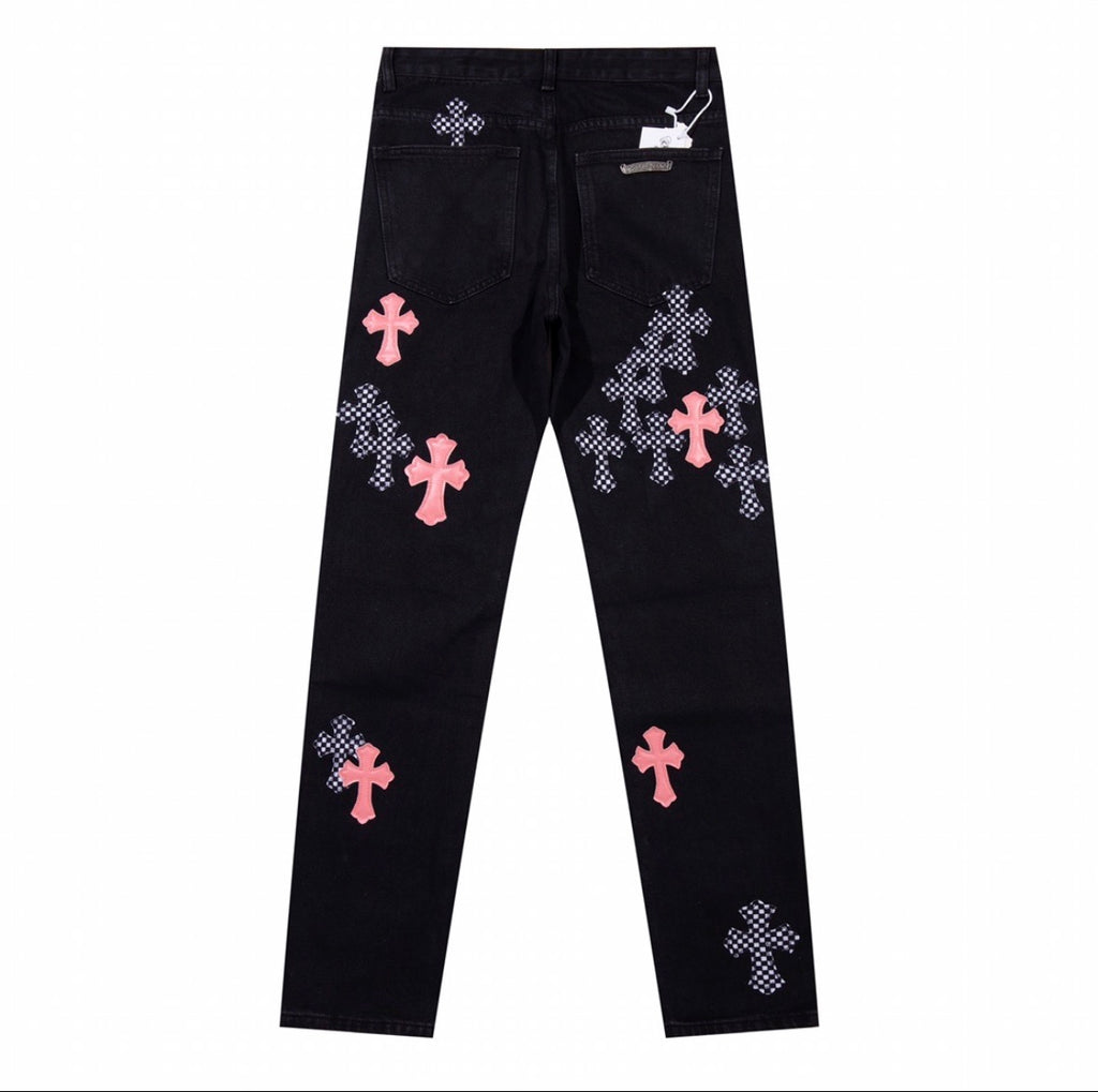Chrome Hearts jeans featuring pink leather and checkered pony hair cross patches