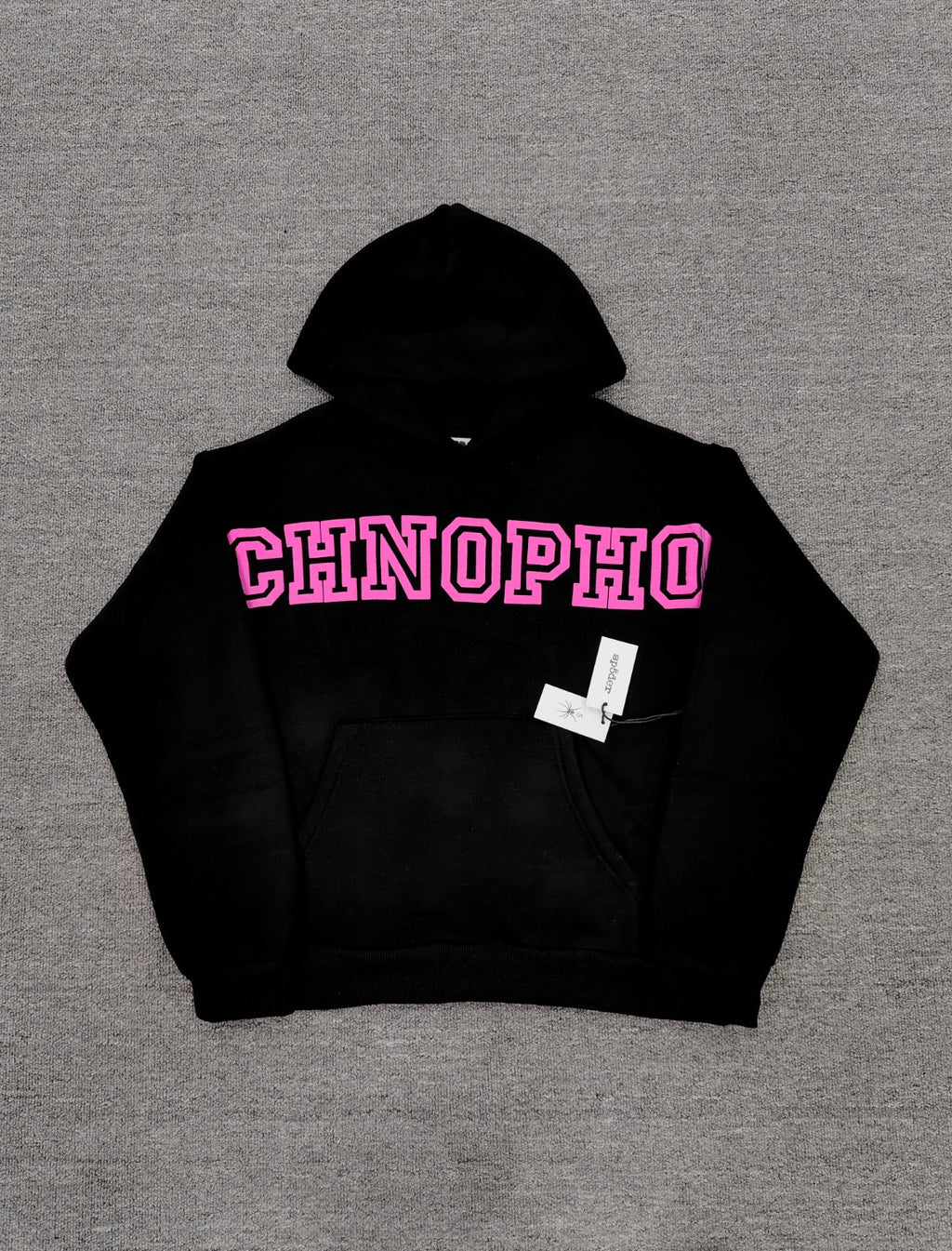 a black Sp5der Arachnophobia hoodie with vibrant pink lettering