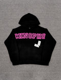 a black Sp5der Arachnophobia hoodie with vibrant pink lettering