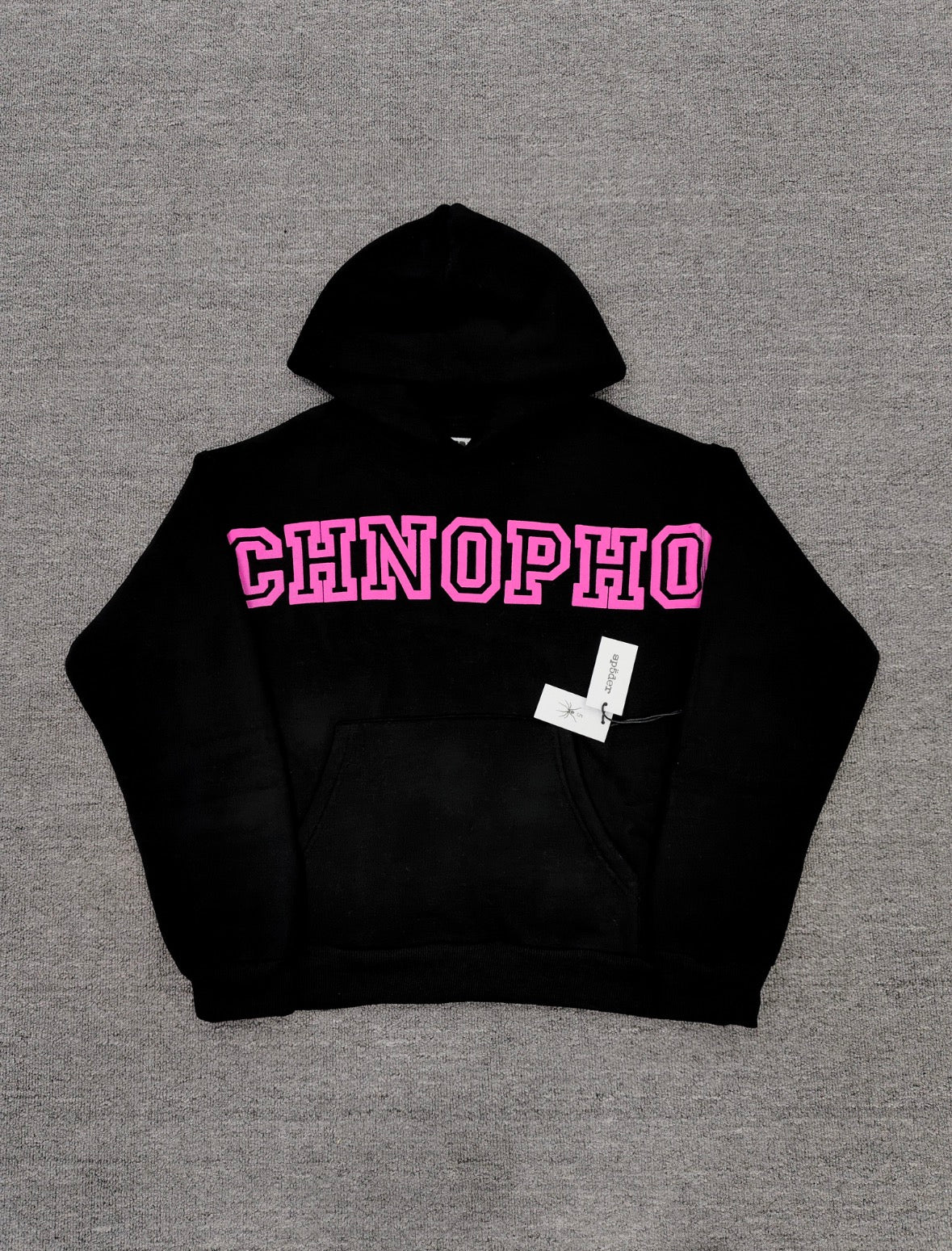 a black Sp5der Arachnophobia hoodie with vibrant pink lettering